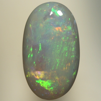 SOLID SEMI BLACK OPAL Orange and green move bright in rolling flashes